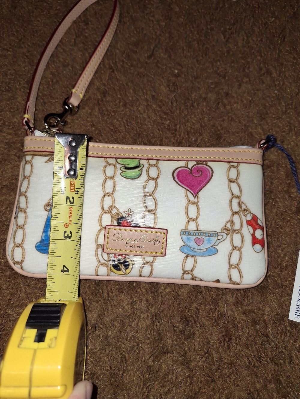 Dooney & Bourke Disney Cream Wristlet w/ Multicolor Charm Print, Like New w/tags - Picture 3 of 7